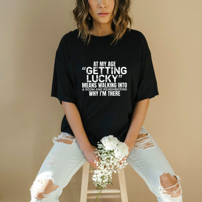 "At My Age Getting Lucky" Funny T-Shirt – Sarcastic Aging Humor Graphic Tee, Unisex Cotton Shirt