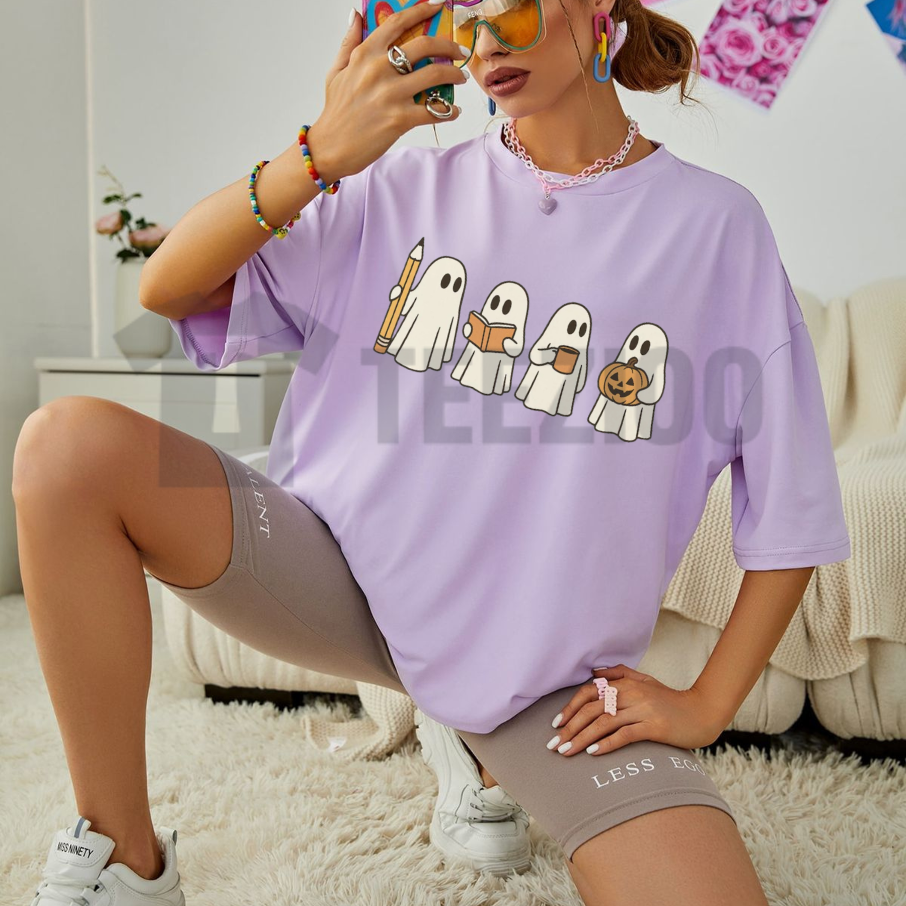Front view of Comfort Colors Spooky Ghost Teacher Halloween Shirt styled in a cozy fall educator outfit - teezioo