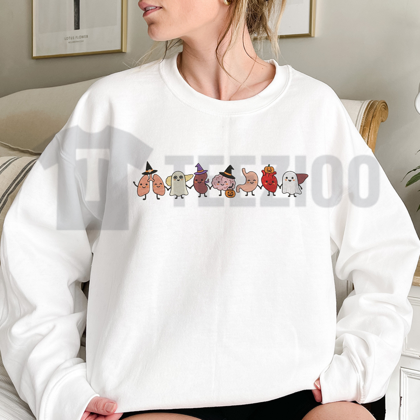 Front view of Halloween Anatomy Embroidered Sweatshirt styled in a spooky autumn medical outfit - teezioo