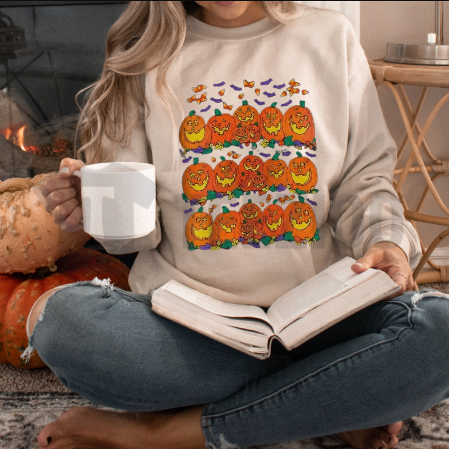 Front view of Halloween Pumpkin Graphic Sweatshirt styled in a cute fall outfit with denim jeans and boots - teezioo