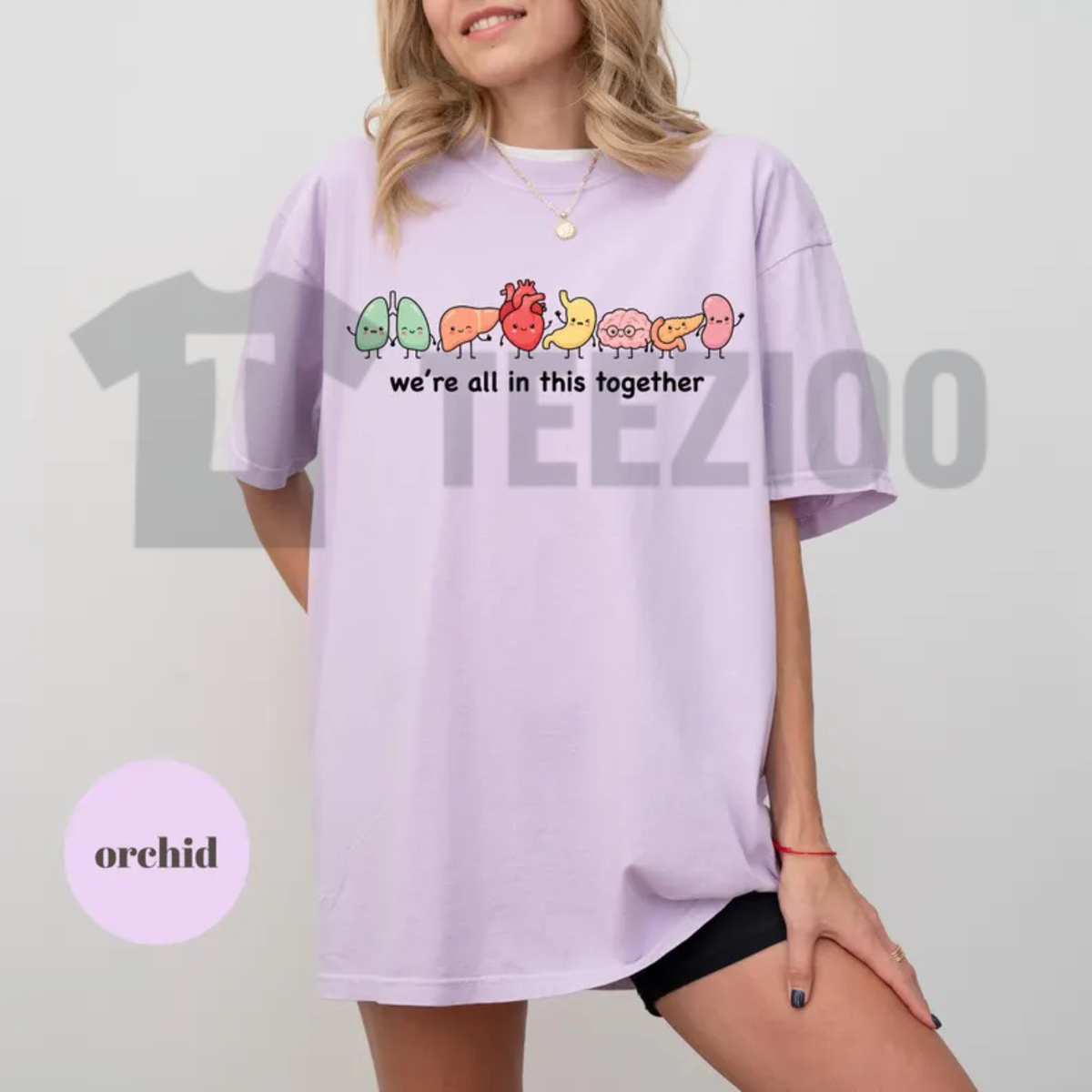 Front view of "We're All In This Together" Cute Organ Anatomy Graphic T-Shirt styled in a casual medical student outfit with denim jeans - teezioo